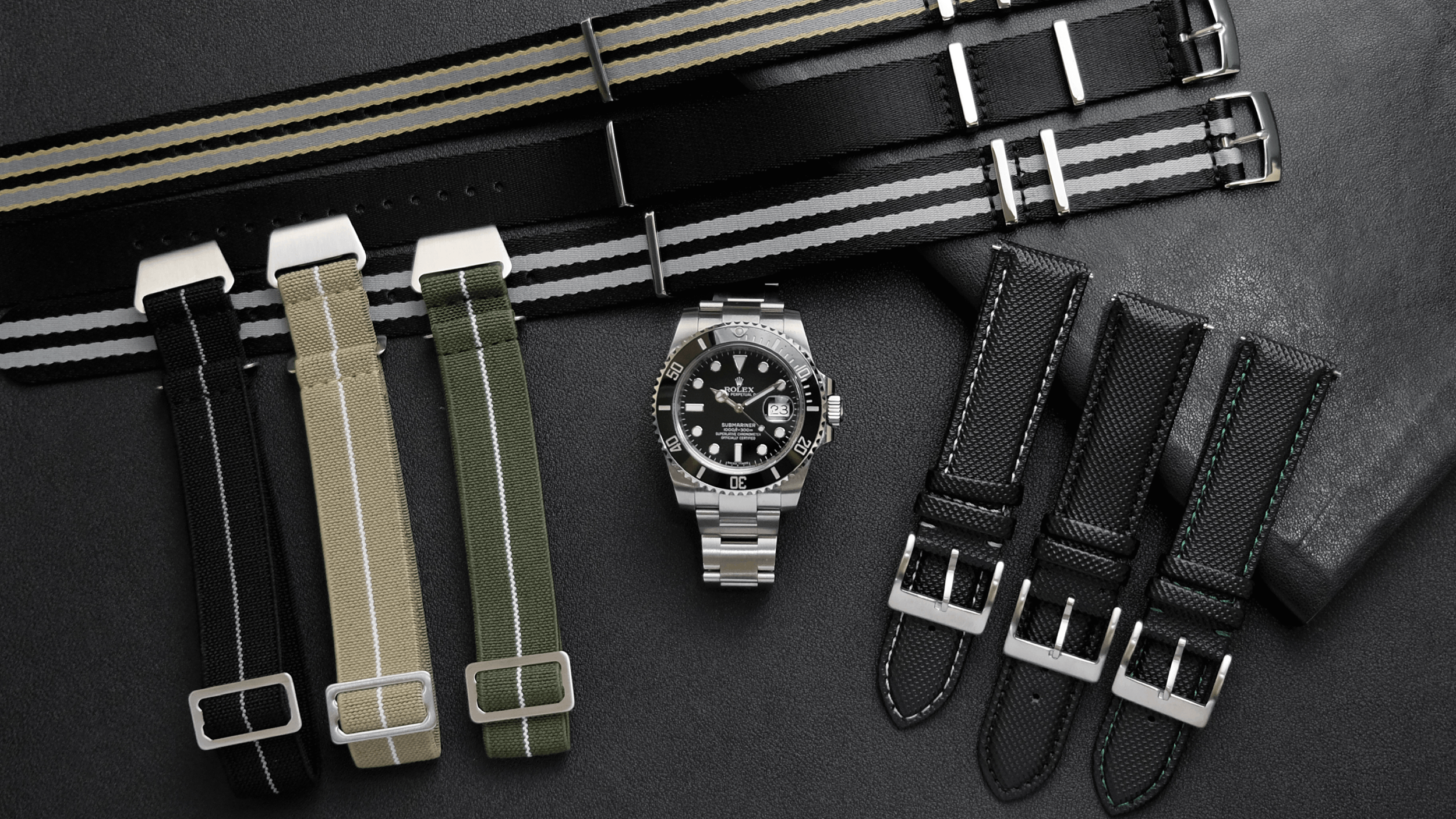 rolex submariner on a bracelet with paratrooper straps submariner, desert storm, army, mega nato straps royale, tuxedo, bond, sailcloth straps manta, barracuda, serpent