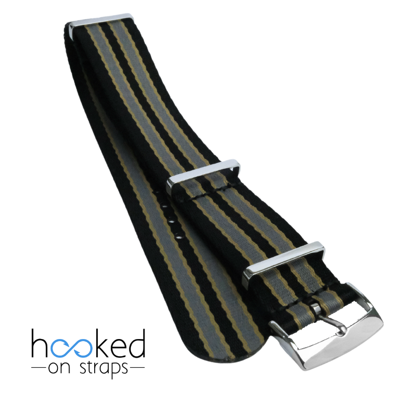 black omega mega seatbelt nato strap with beige and gray stripes bond 007 no time to die